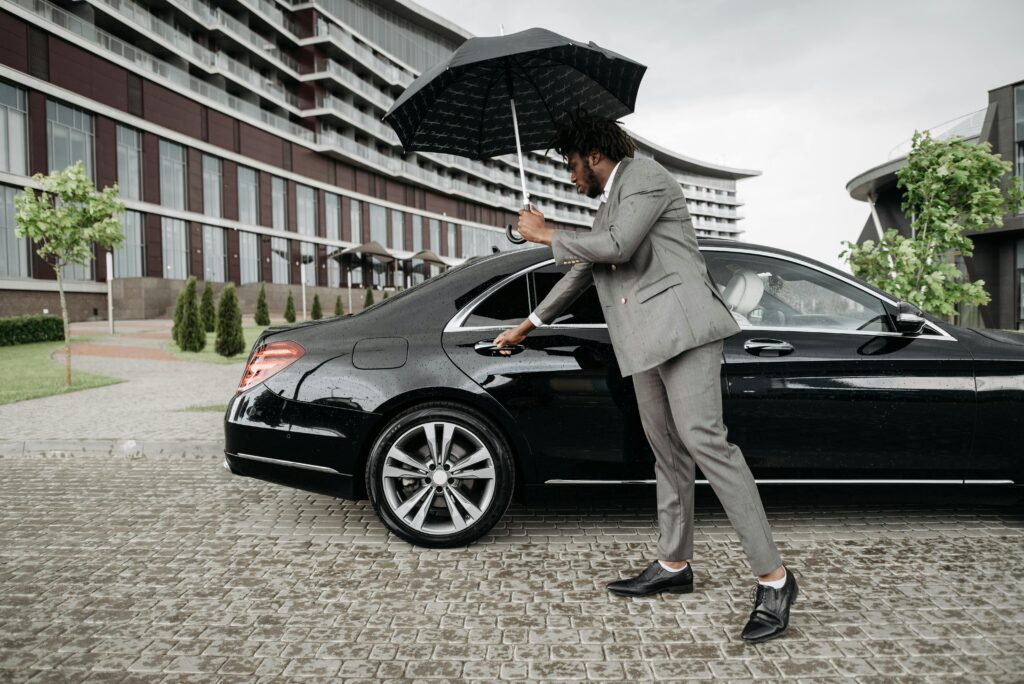 Chauffeur Driver Opening the door for a client